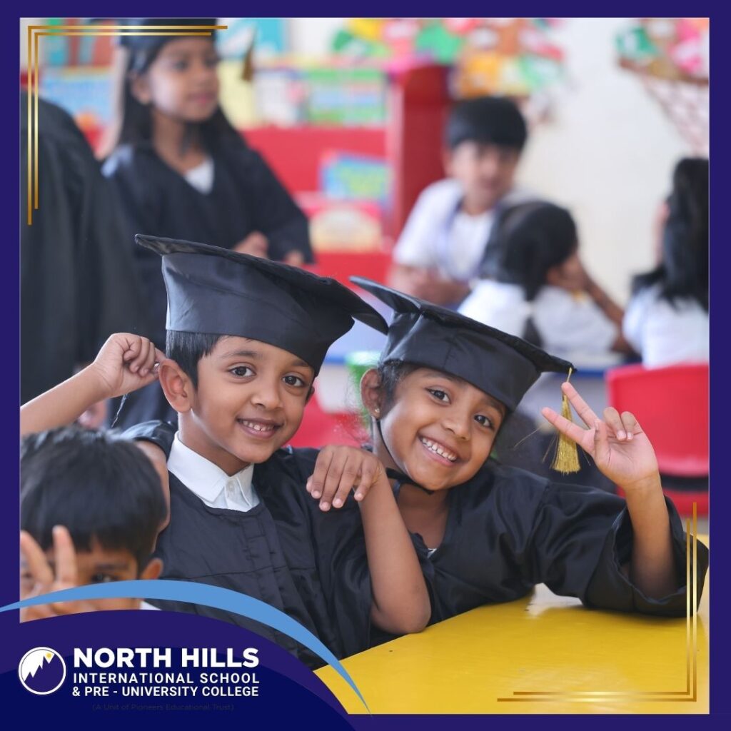 Kids wearing graduation caps