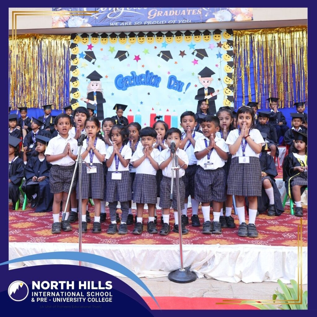 Students singing on graduation stage